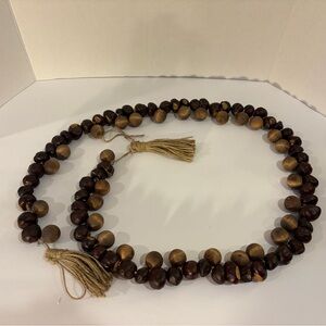 Buckeye and wood bead garland with tassels